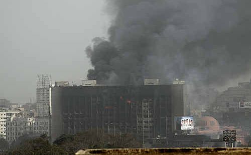 David Skennerton photographed a burning government building from the Cairo hotel they were staying in during anti-government protests. David Skennerton photographed a burning government building from the Cairo hotel they were staying in during anti-government protests.